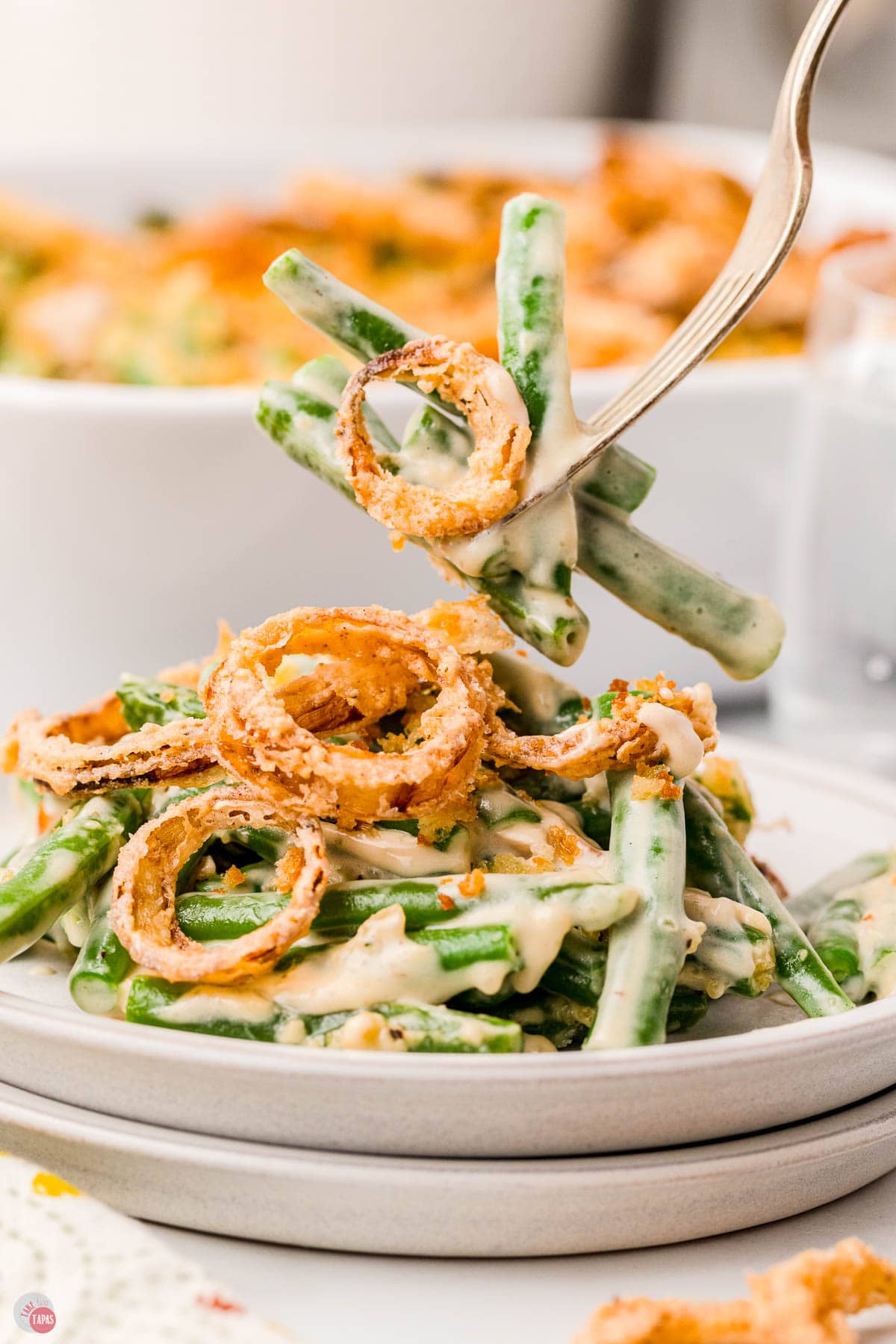 fork with bite of green beans and onions