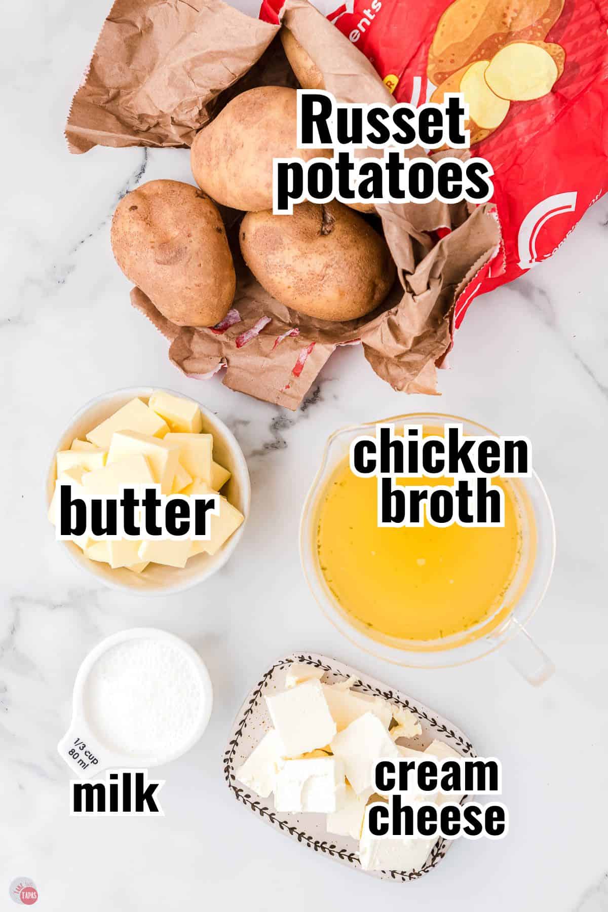ingredients for million dollar ahed potatoes recipe in individual bowls with text overlay labeling them
