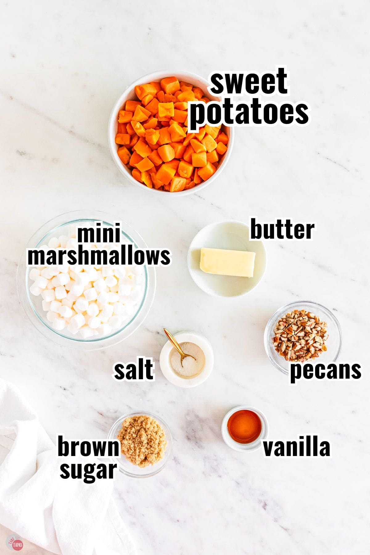 ingredients for a sweet potato casserole recipe in individual bowls with text overlay labeling them
