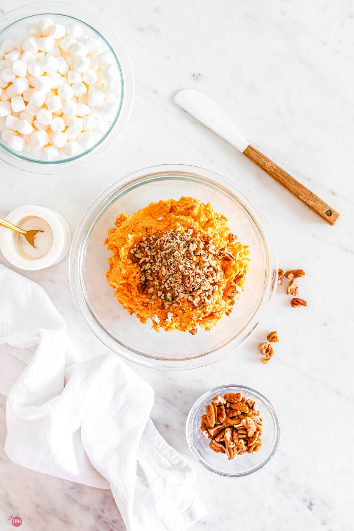 bowl of mashed sweet potatoes topped with brown sugar