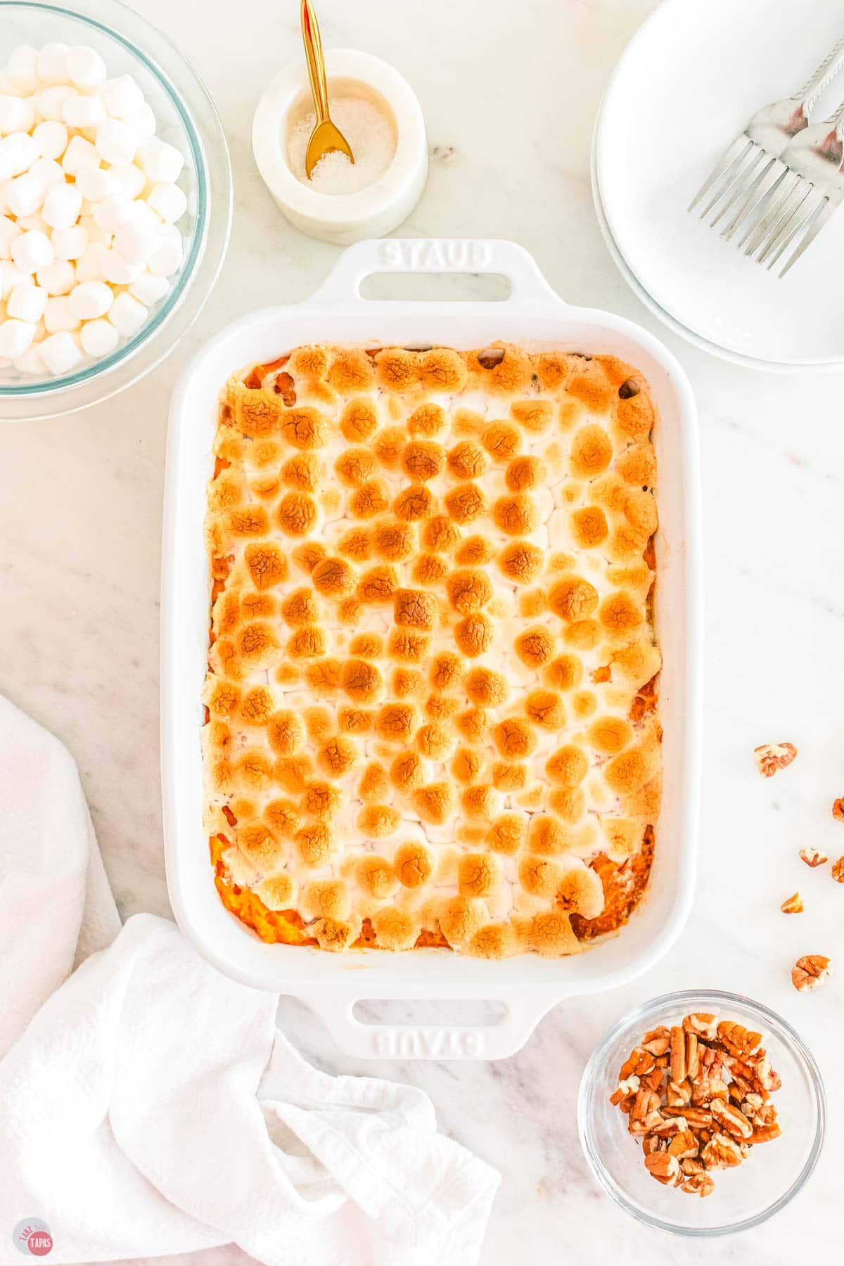 baked sweet potato casserole in a white casserole dish