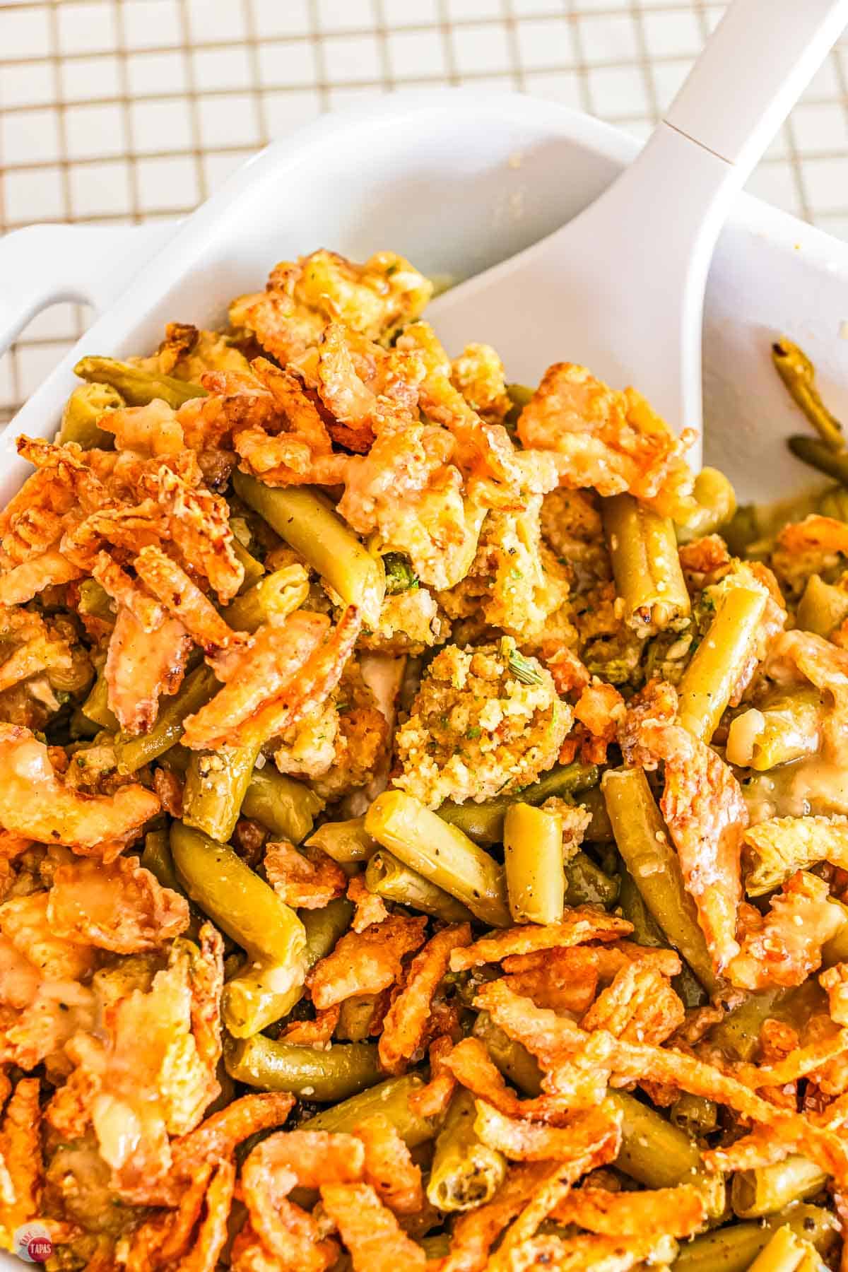 close up of green beans and fried onions on top