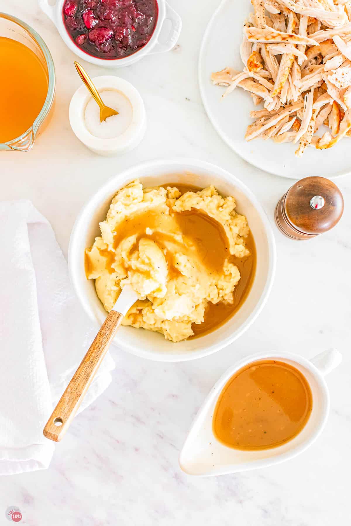 bowl of mashed potatoes with gravy poured on top