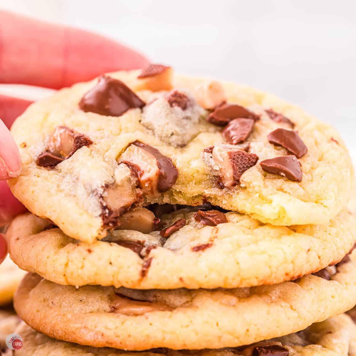 hand holding a toffee cookie