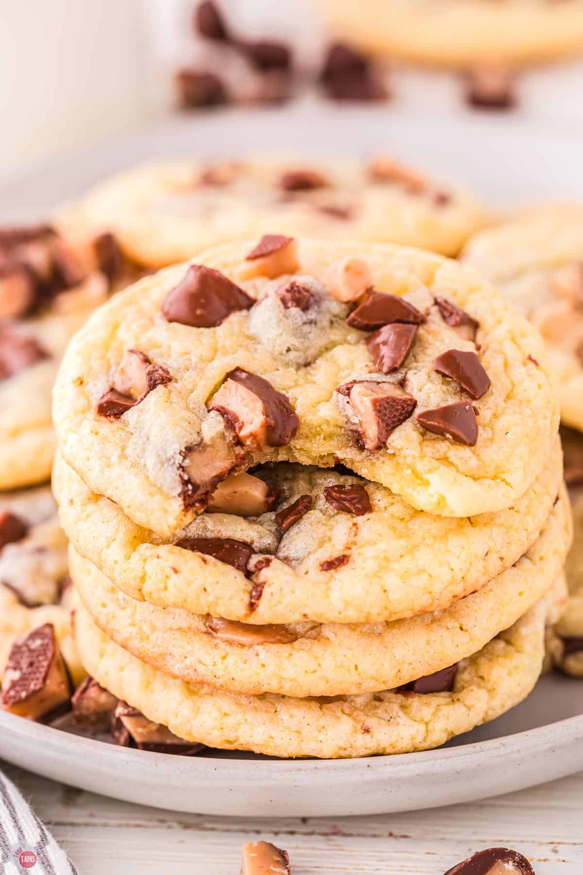 close up of stack of cookies with a bite missing out of the top one