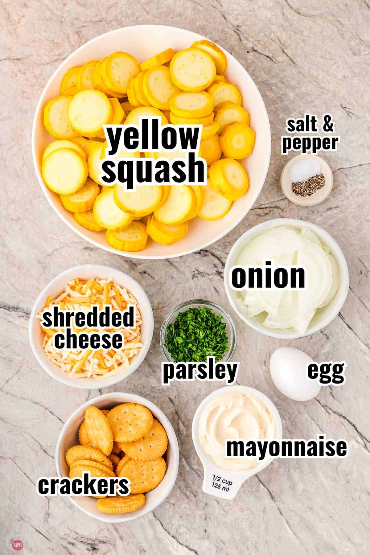 ingredients for a squash casserole in individual bowls with text overlay labeling them