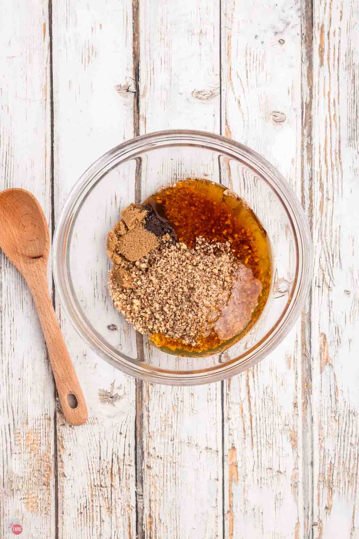 clear bowl of chopped pecans, honey, and brown sugar