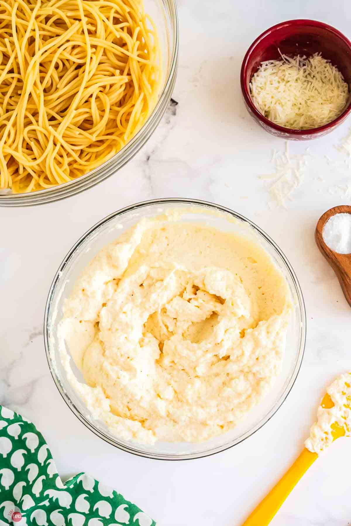 clear bowl full of a ricotta cheese mixture
