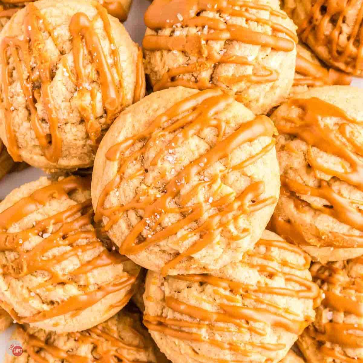 close up of pile of cookies drizzled with cookie butter drizzle