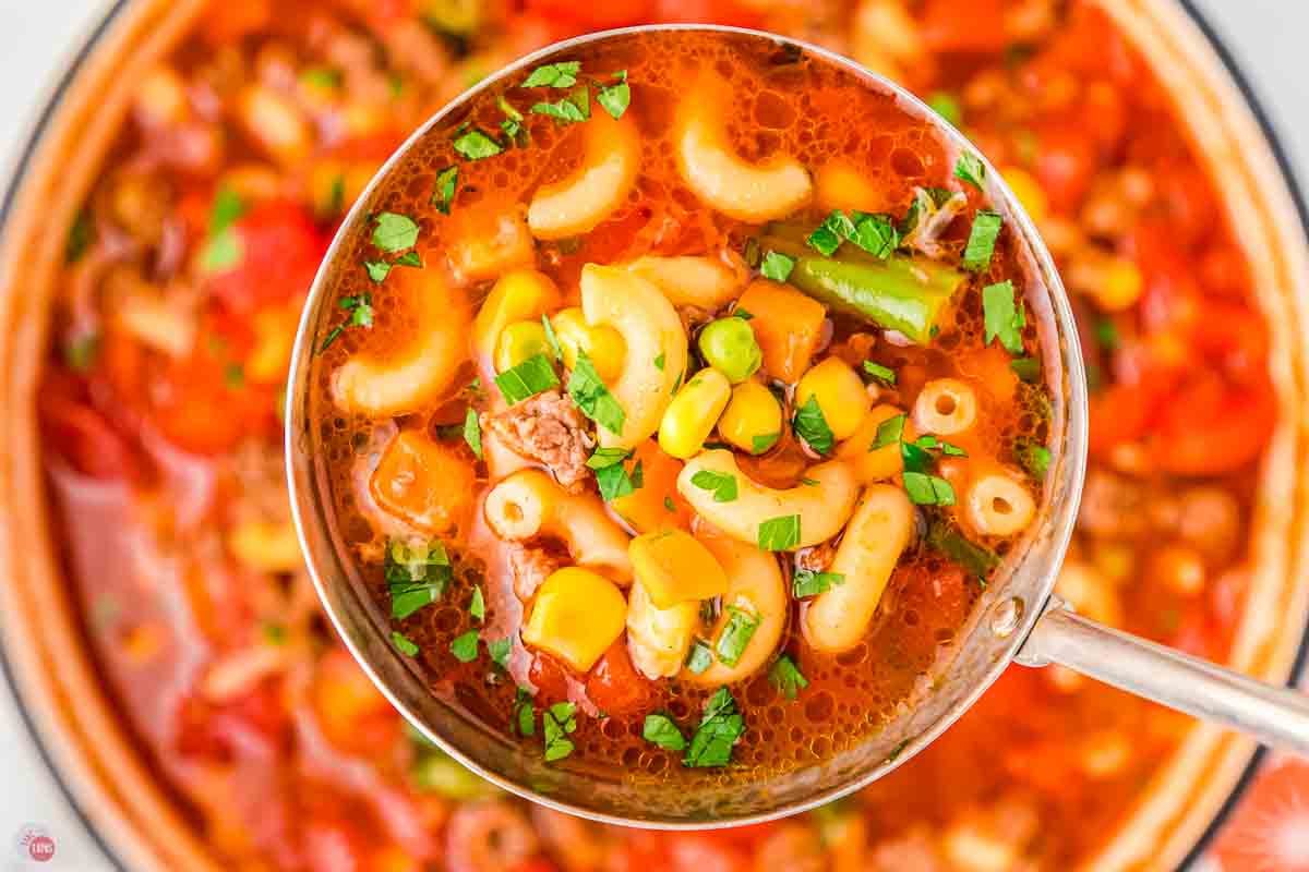 close up of ladle of soup