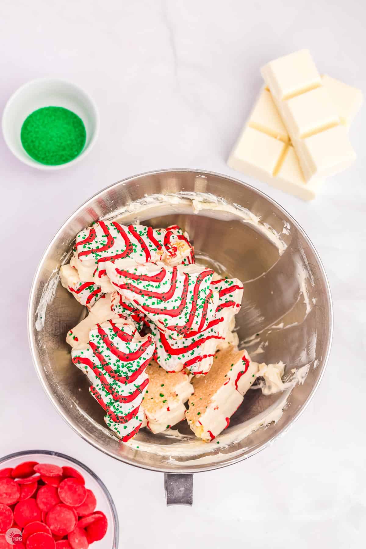 Christmas tree cakes in a metal mixing bowl