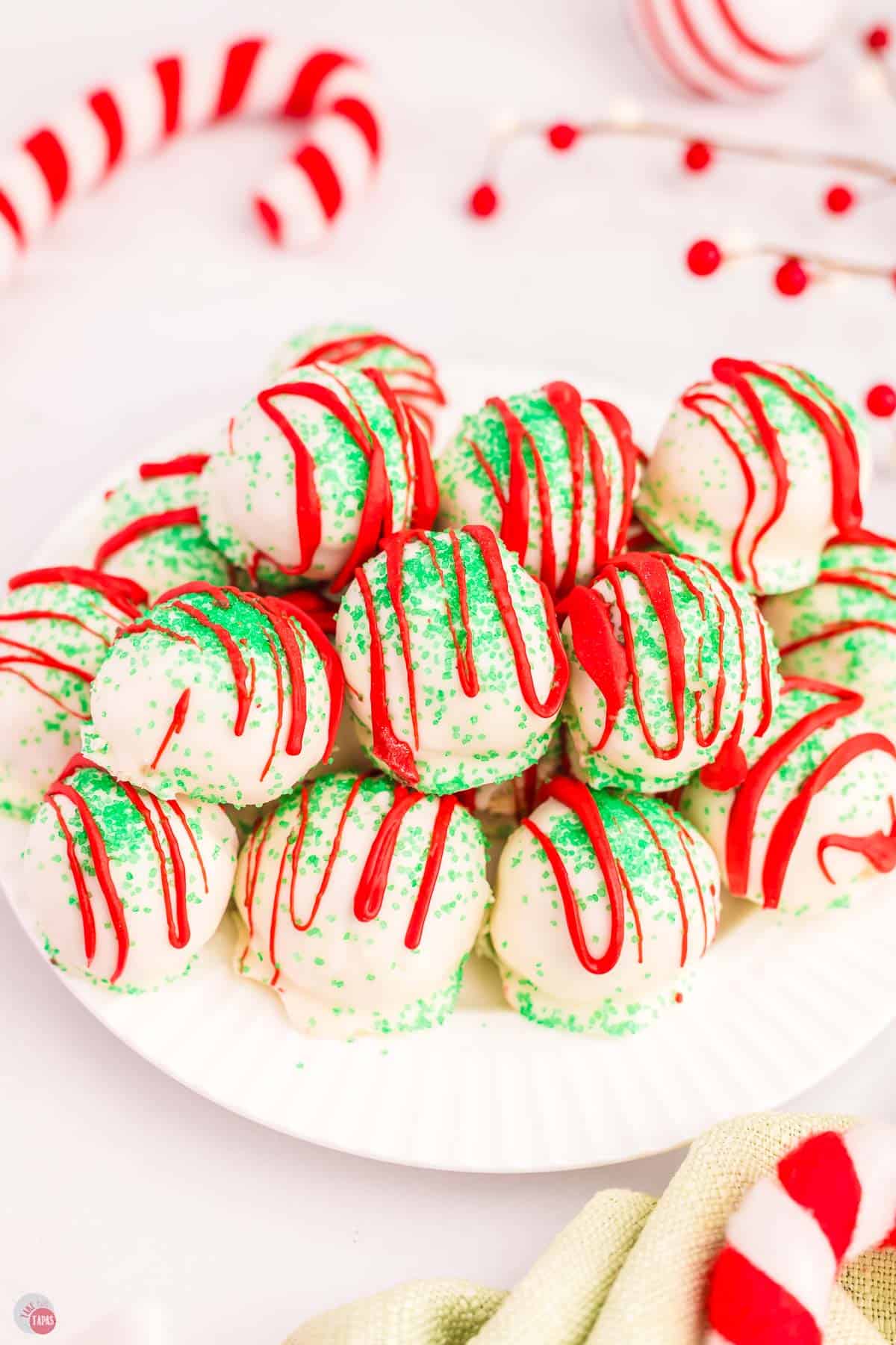 plate with Christmas tree cake balls stacked on top