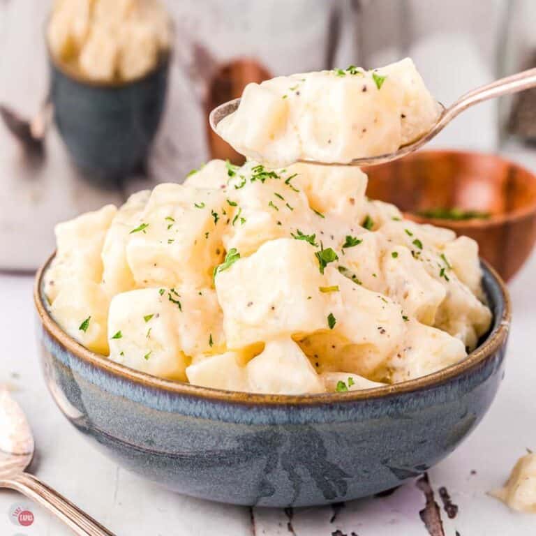 bowl of creamed potatoes with a spoon