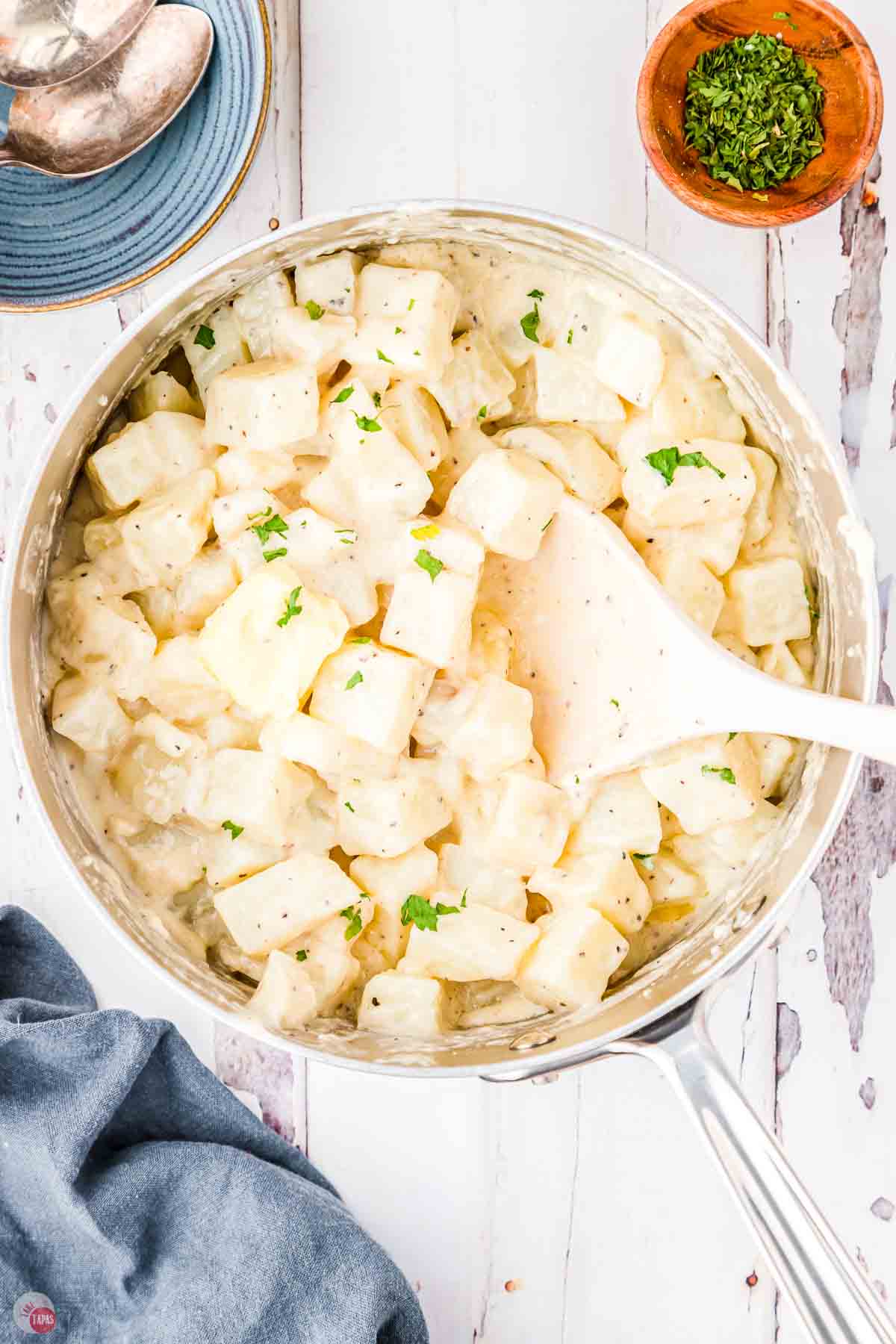 pot of creamed potatoes and white spoon