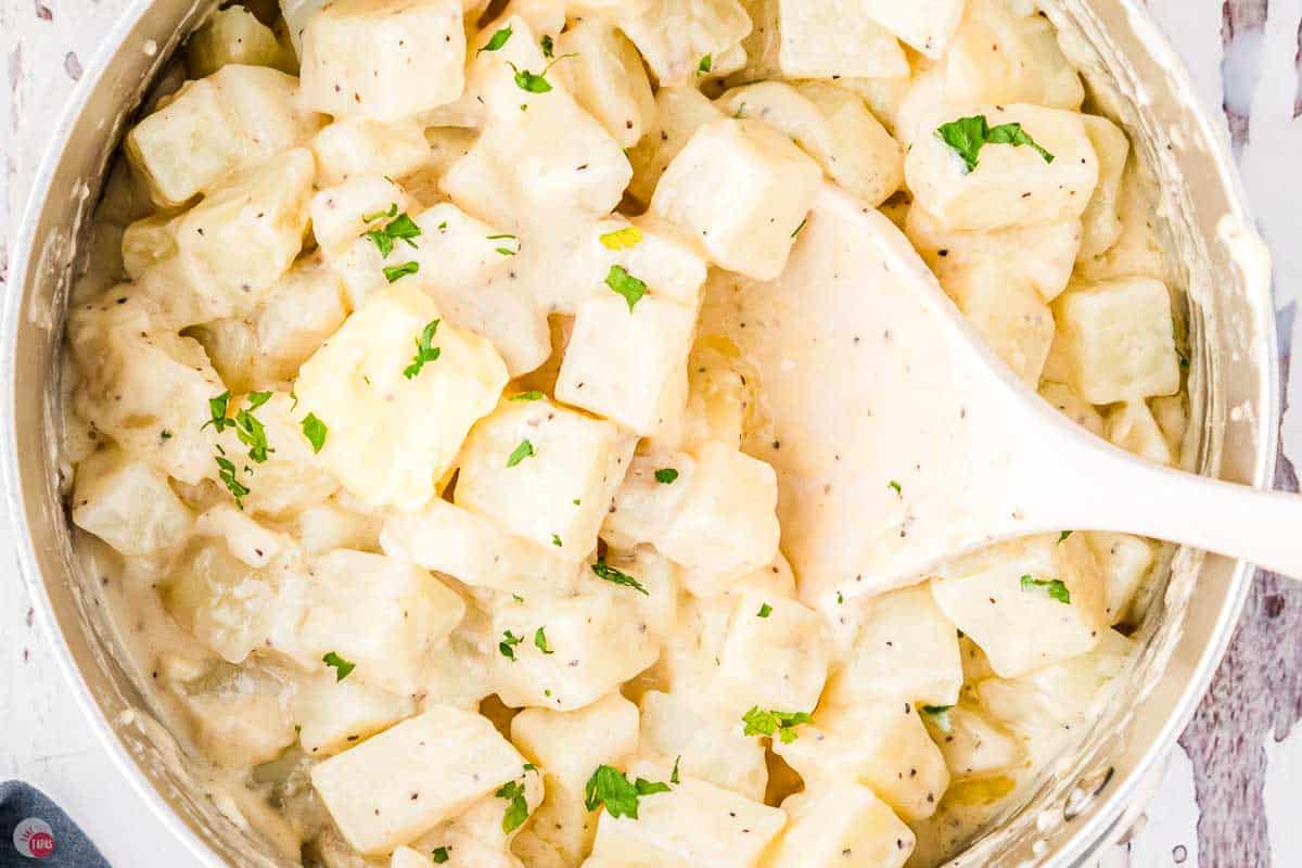 close up of diced potatoes and a spatula