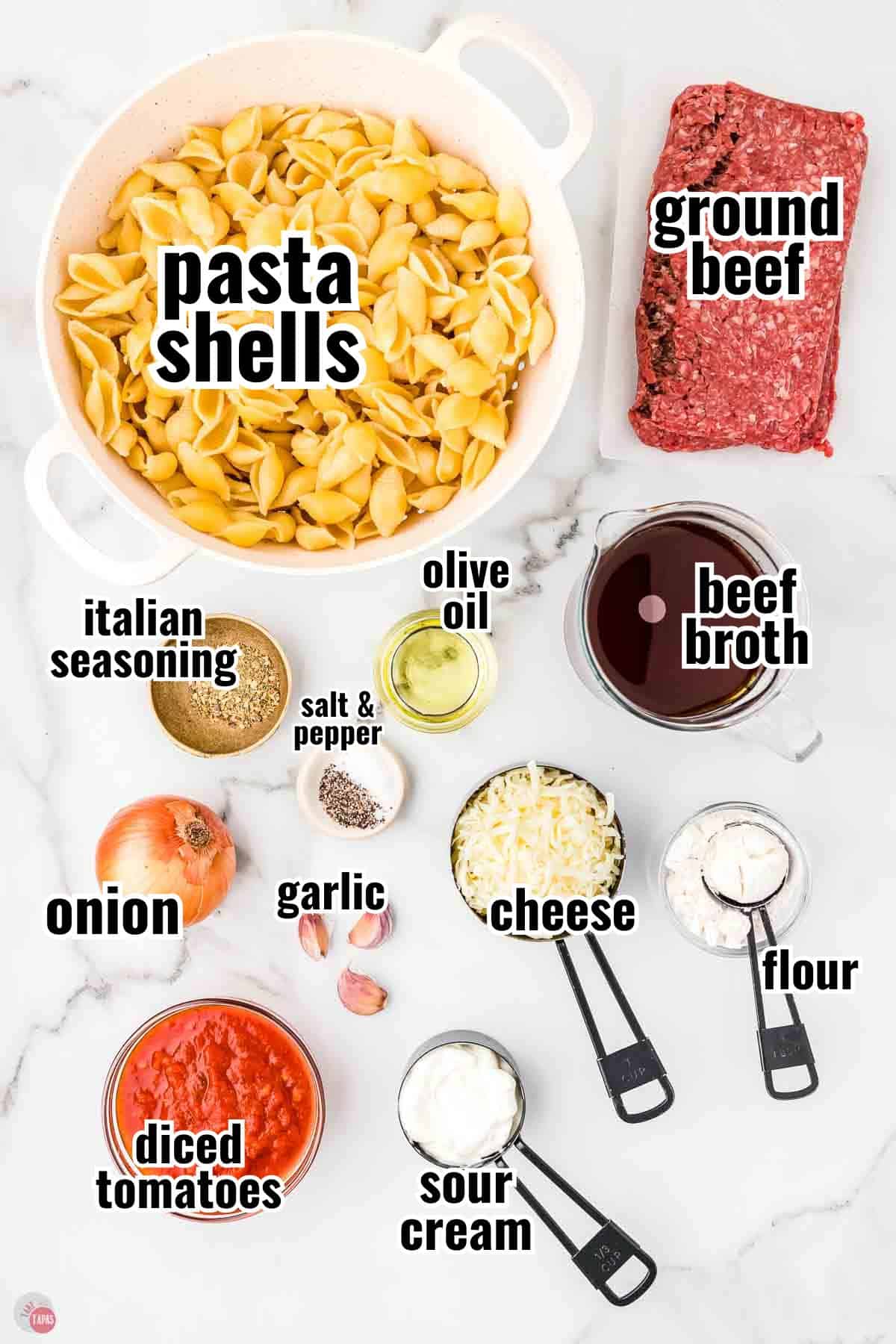 ingredients for a one pot beef and shells recipe in individual bowls with text overlay labeling them