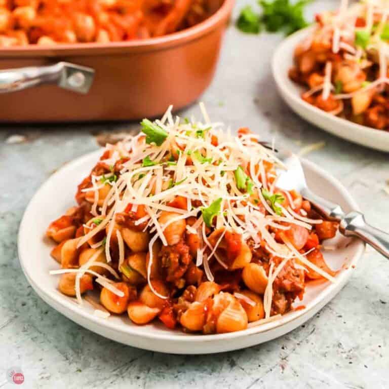 plate of beefaroni topped with shredded cheese