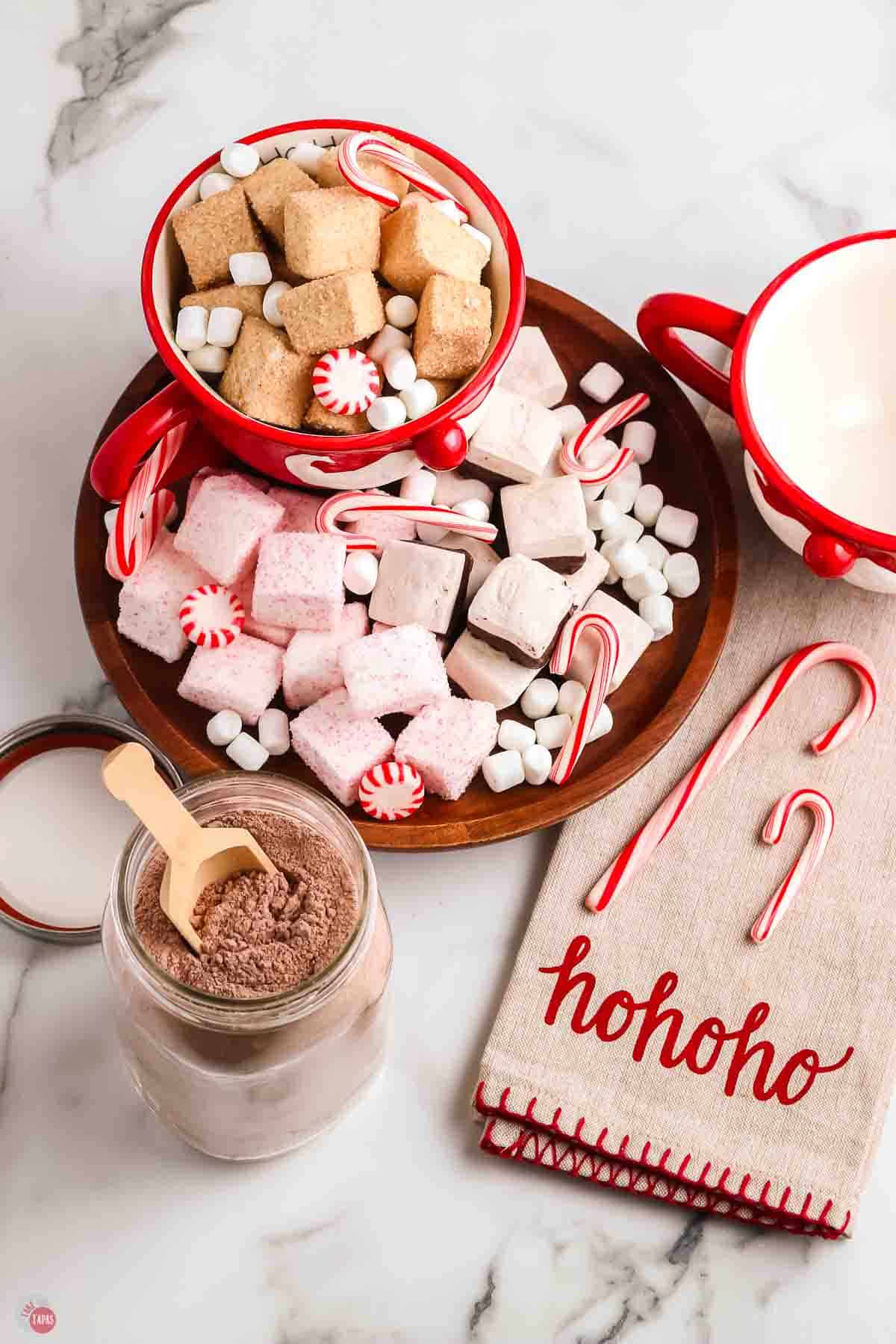 overhead picture of cocoa mix with napkin and bowl of marshmallows