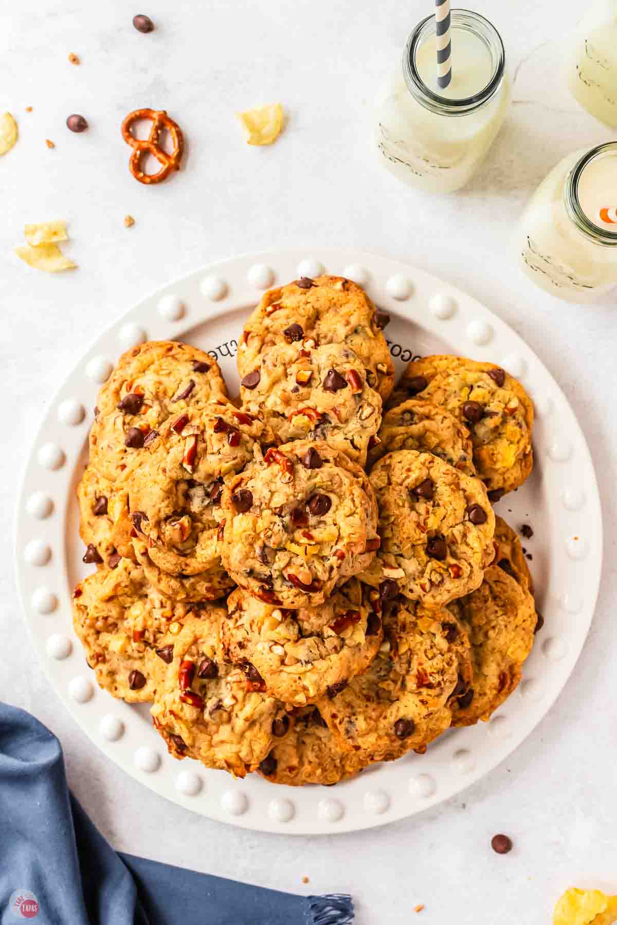plate of kitchen sink cookies and two glasses of milk