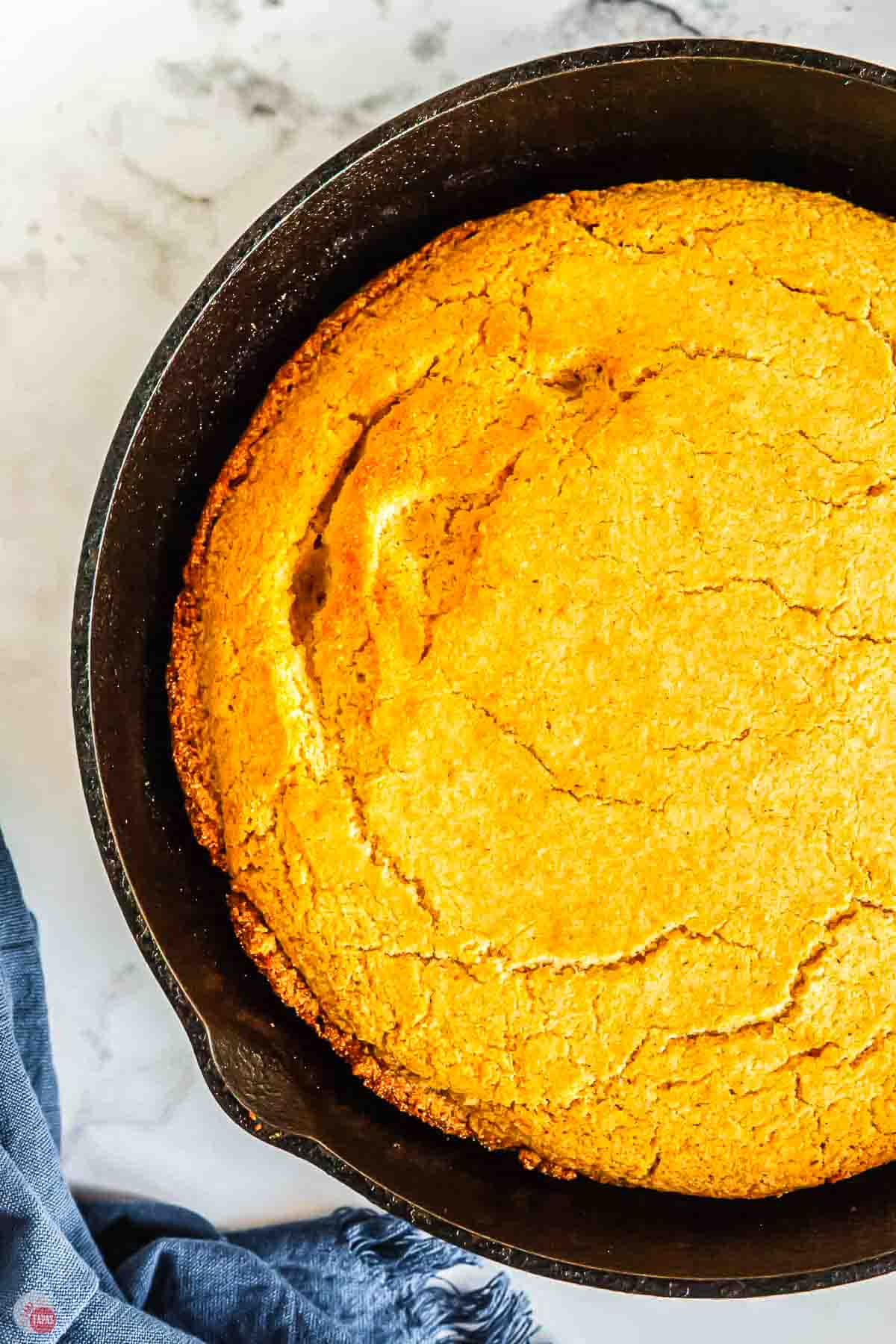 close up of cornbread in a cast iron skillet