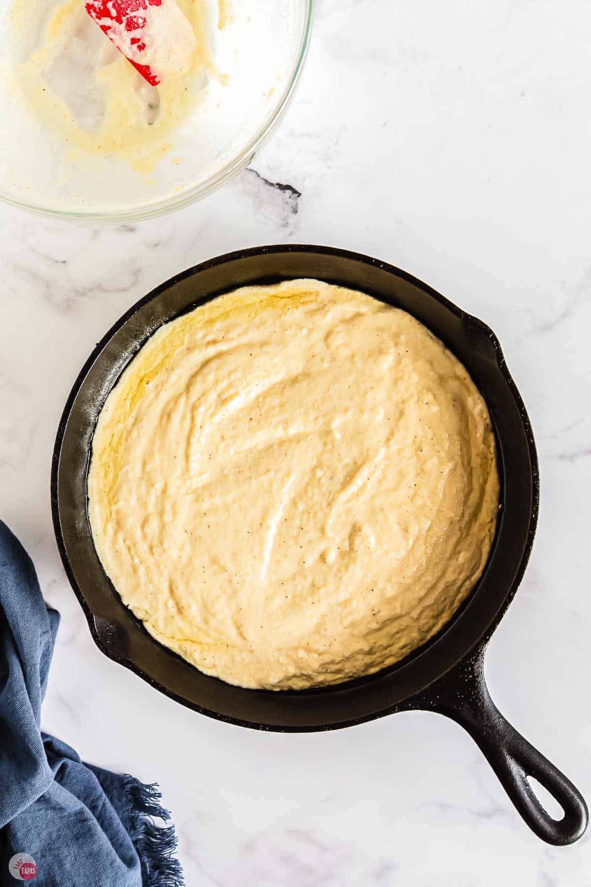 cornbread batter in a skillet
