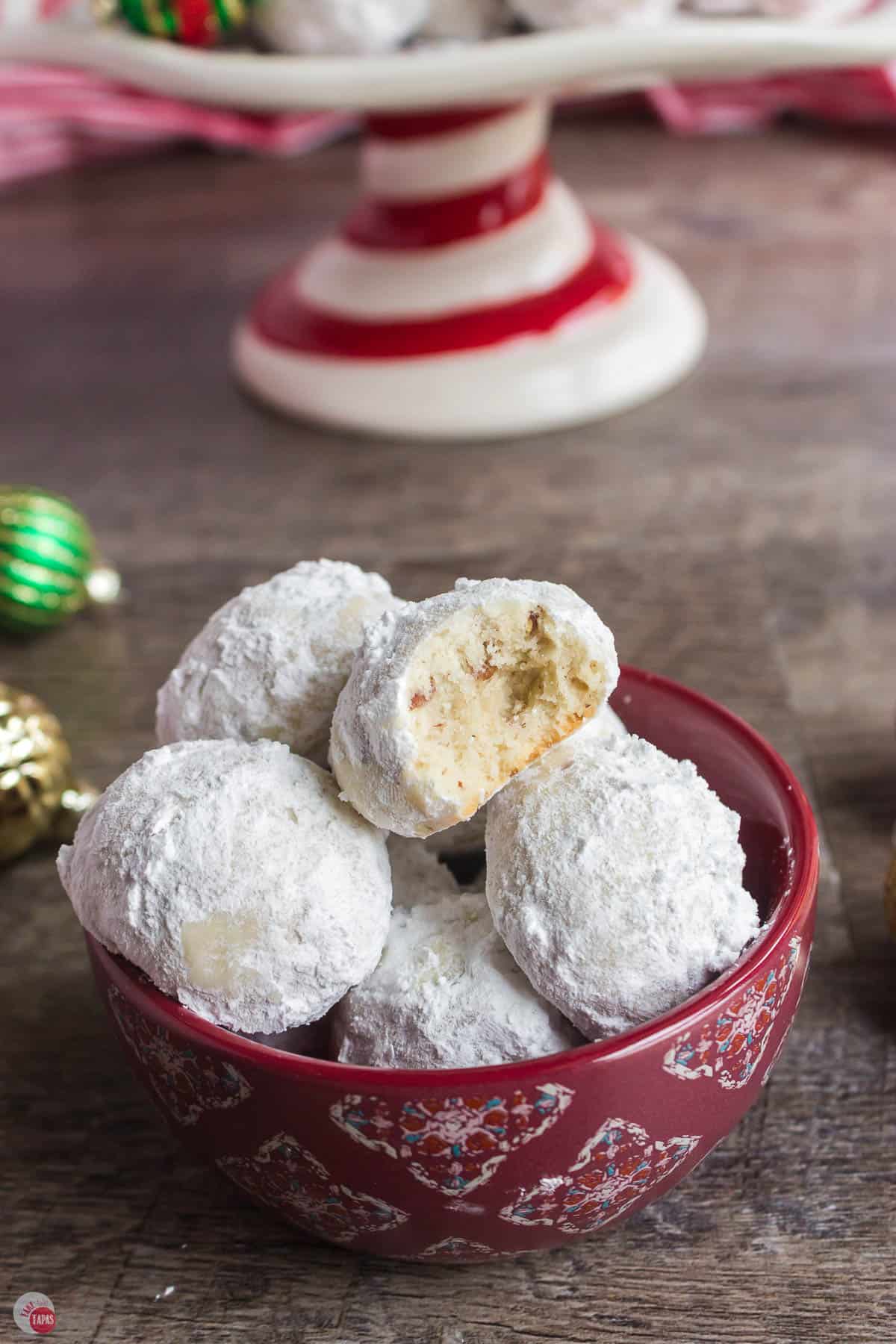 red bowl of snowball cookies