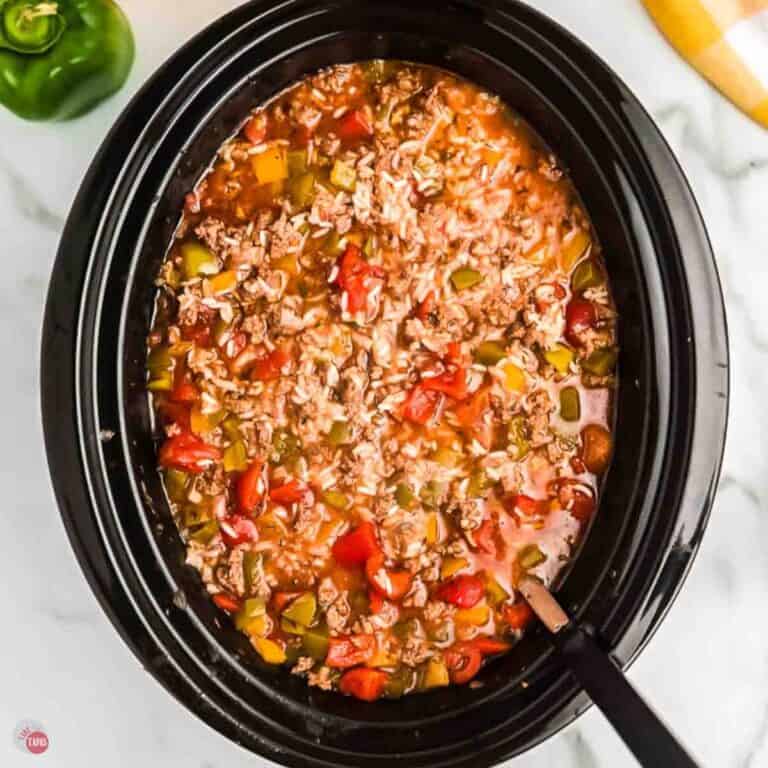 crock pot bell pepper soup with a ladle