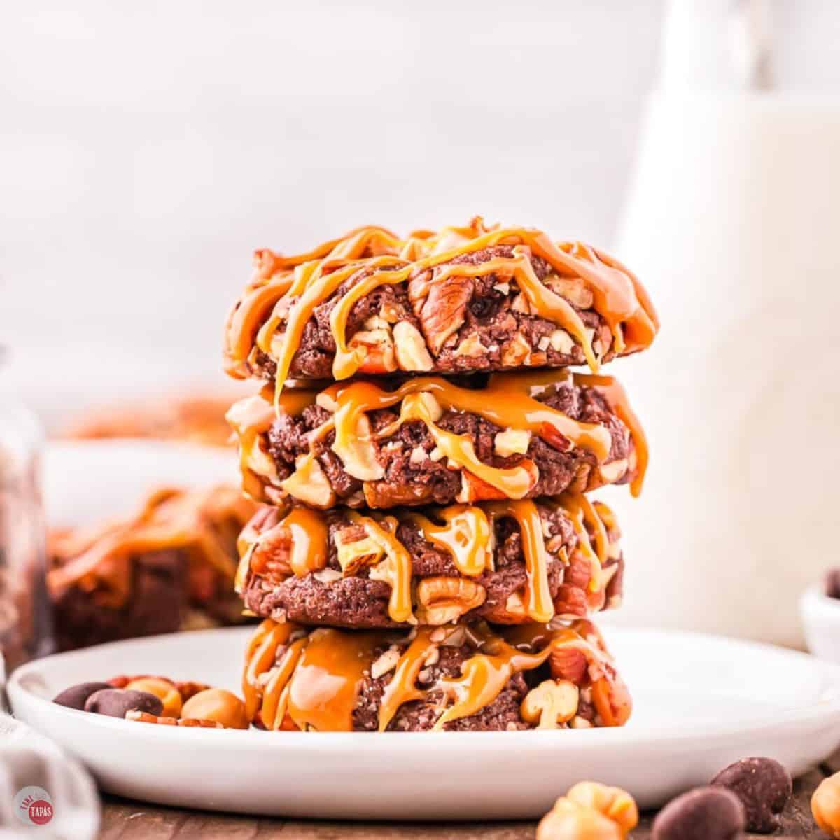 stack of 4 cookies on a white plate