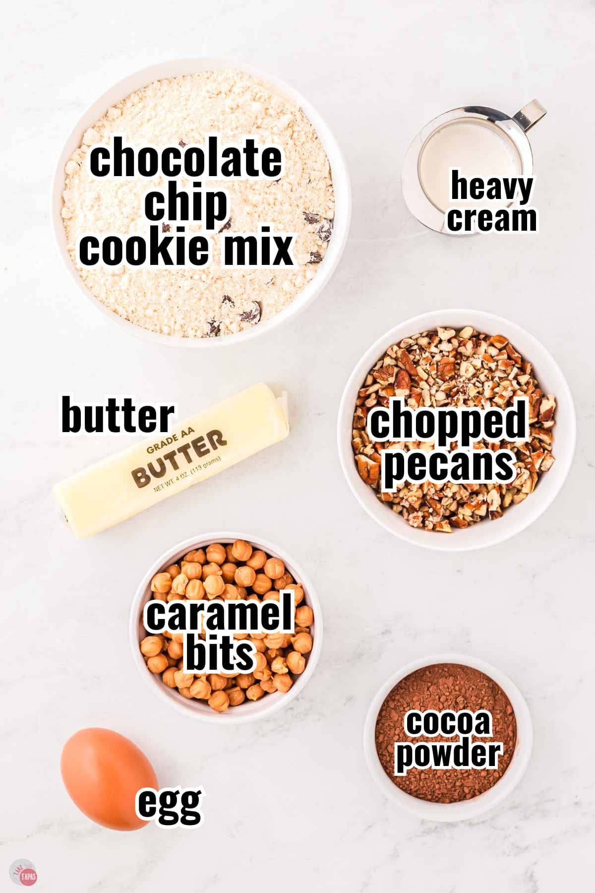 ingredients for chocolate caramel pecan cookie recipe in individual bowls with text overlay labeling them