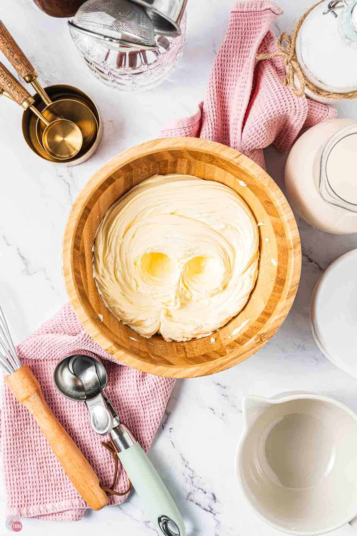 whipped butter in a wood bowl