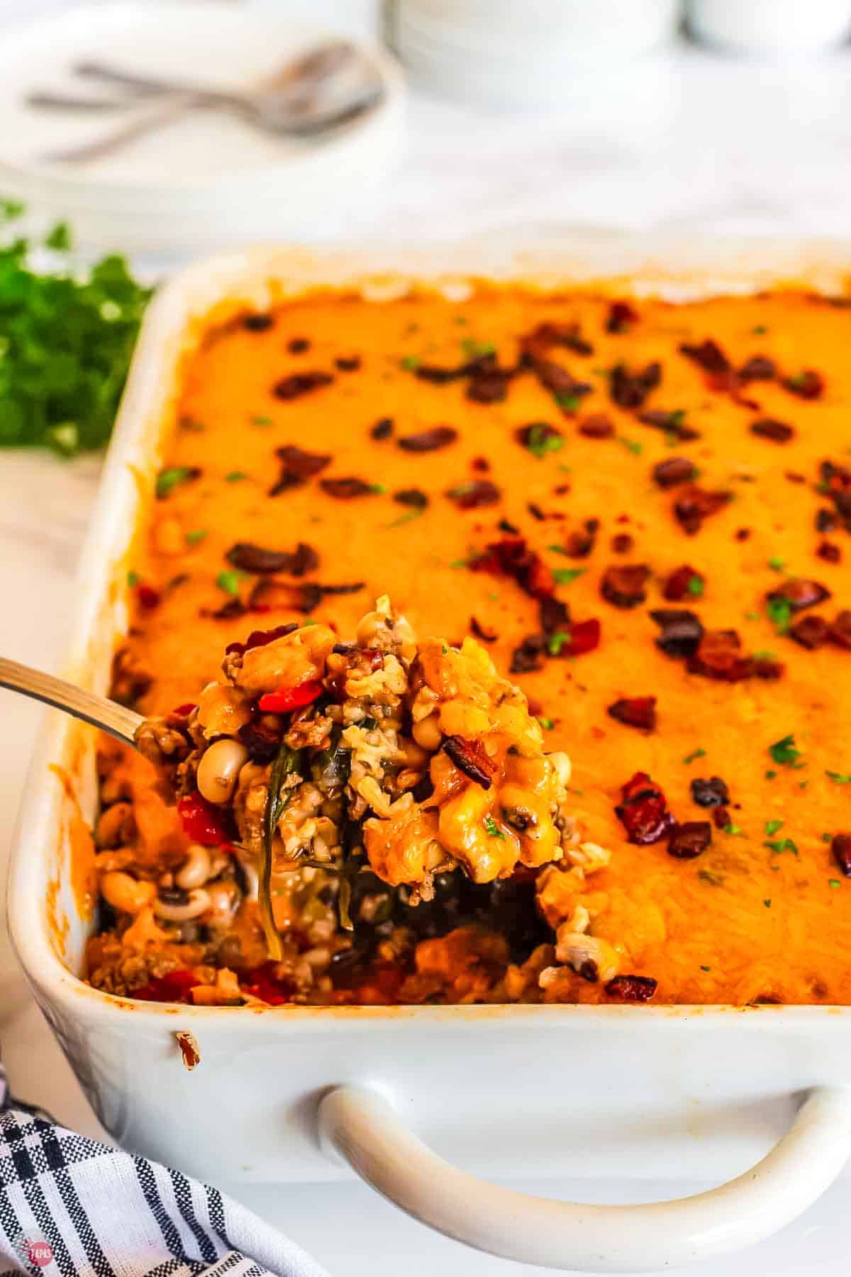 spoon scooping out casserole