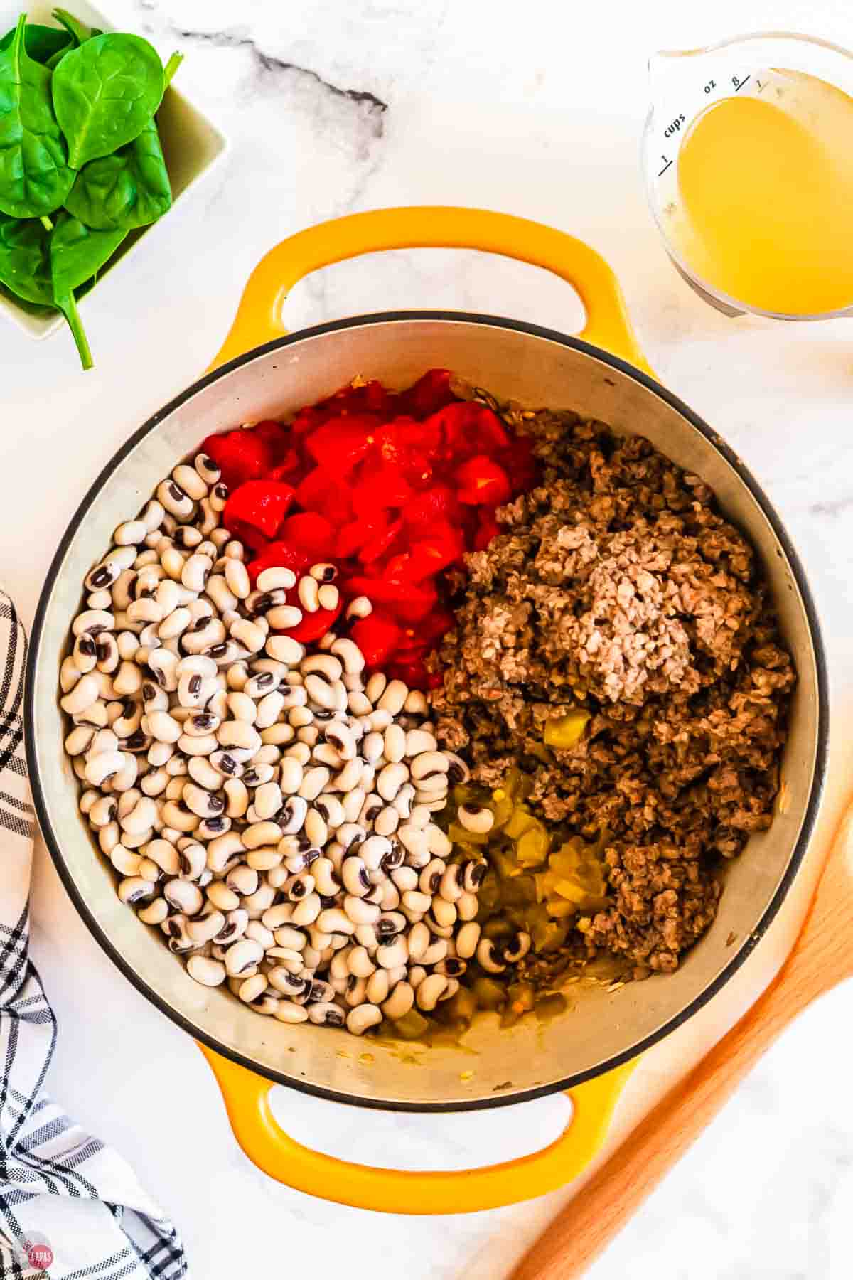 black eyed peas and ground pork in a pot