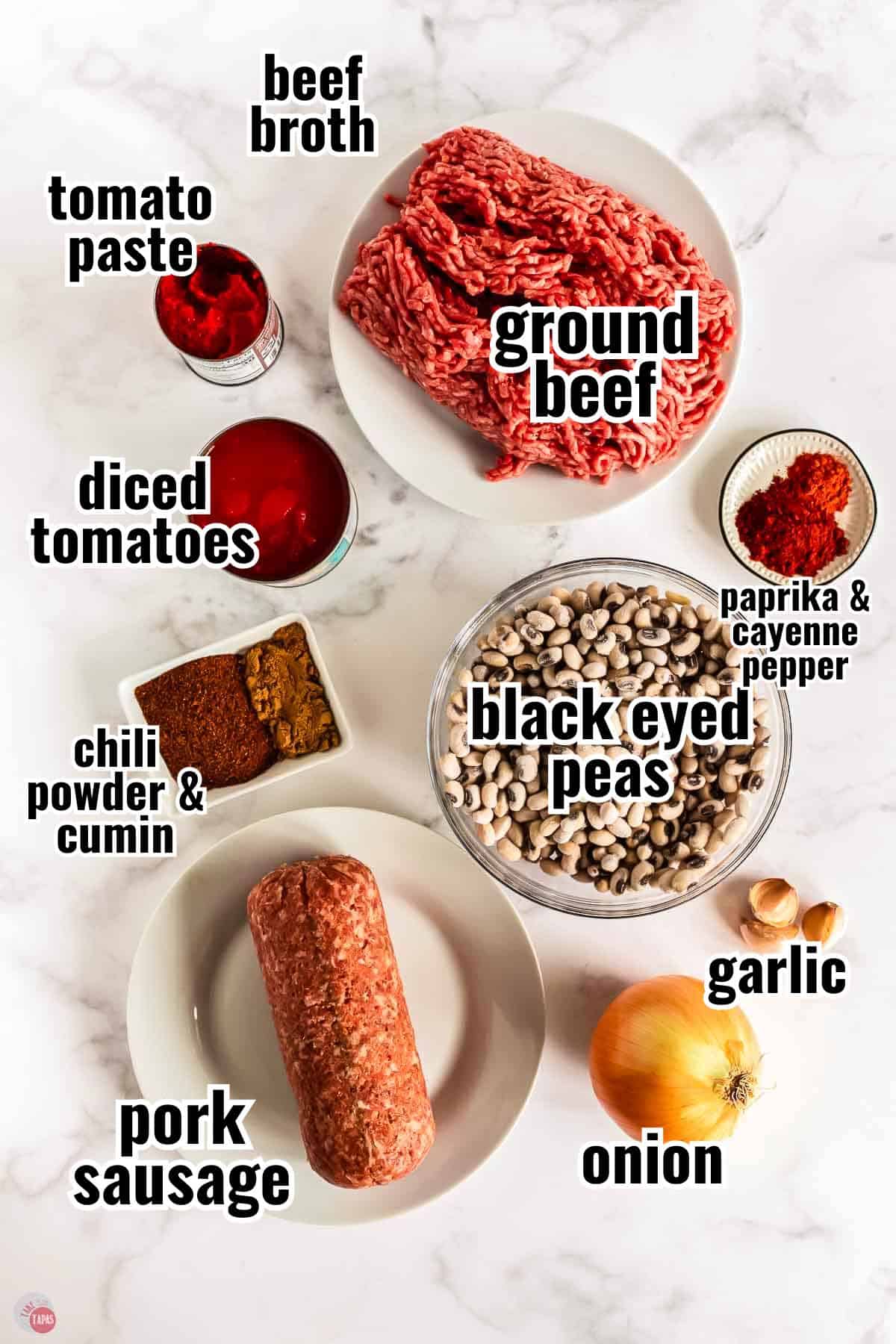 ingredients for a chili recipe in individual bowls with text overlay labeling them