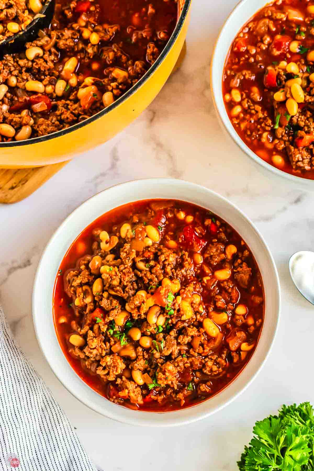 close up of bowl of chili with black eyed peas