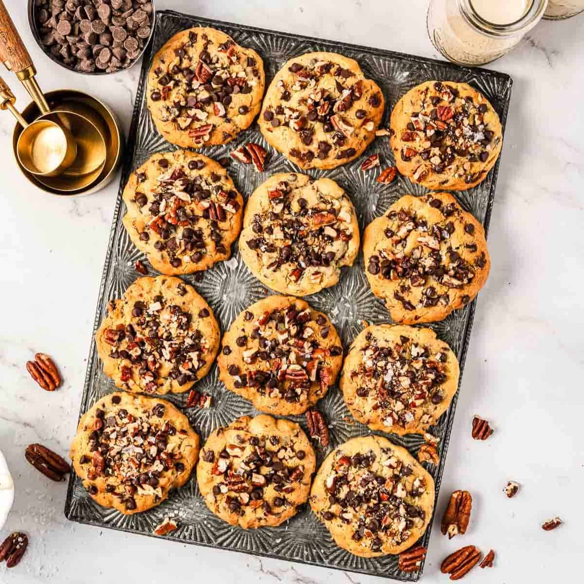 metal serving tray with 12 cookies on it
