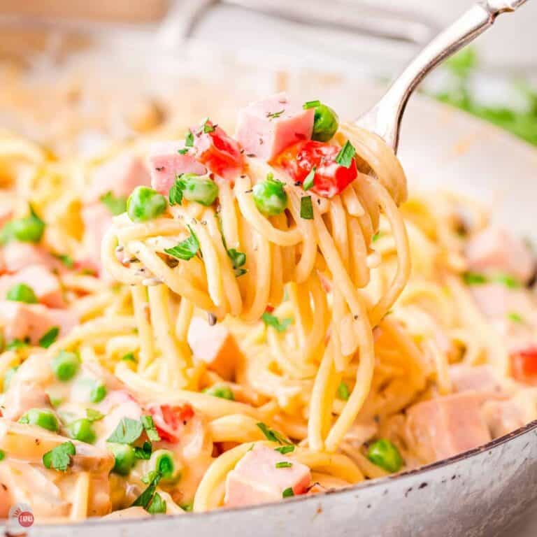 fork with big bite of ham tetrazzini