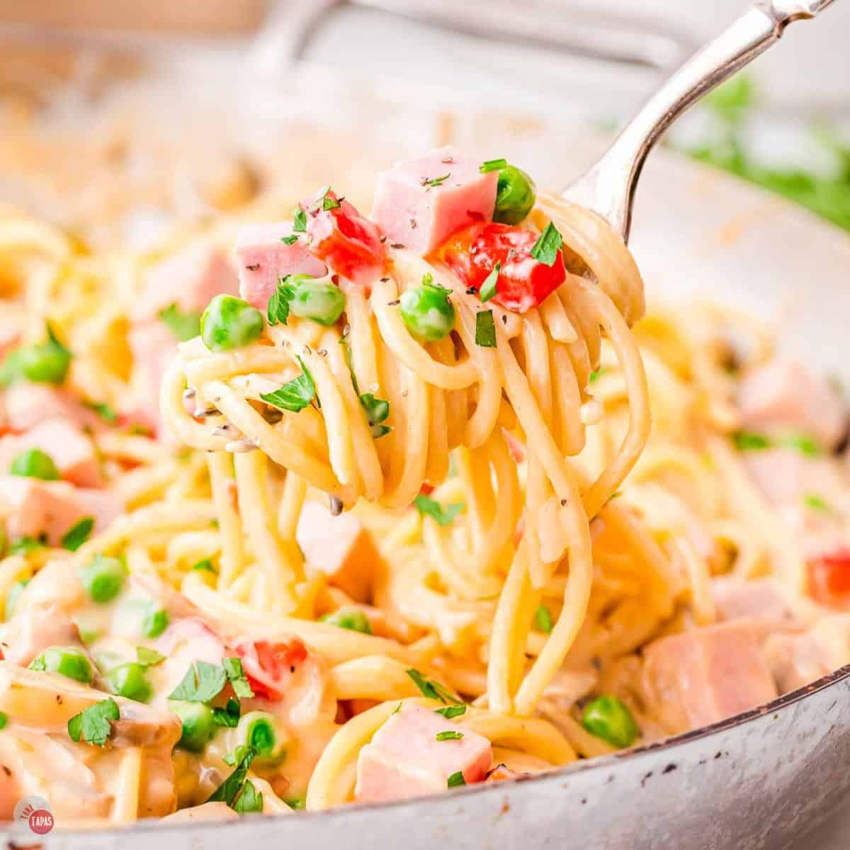 fork with big bite of ham tetrazzini