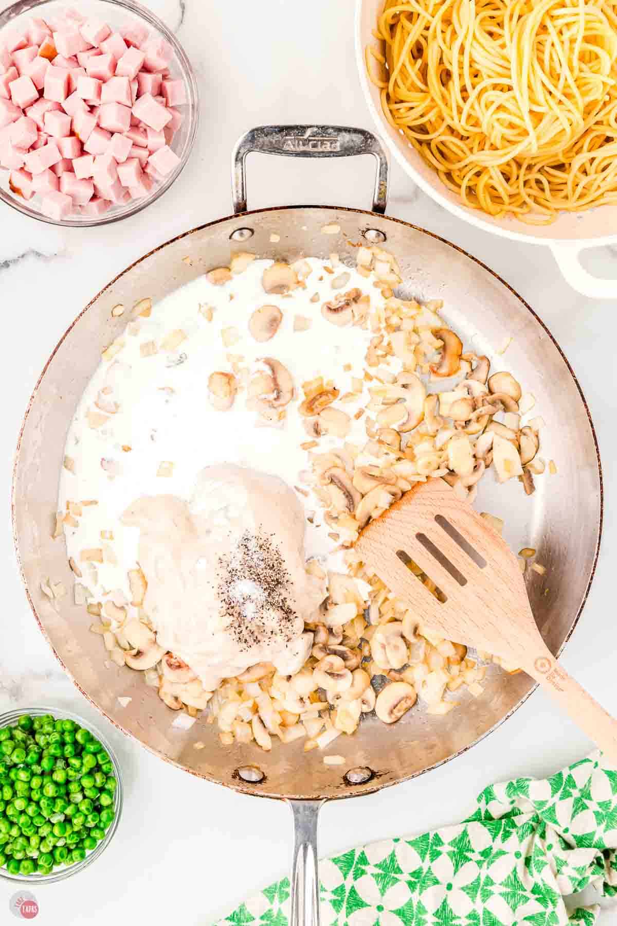 skillet with roasted mushrooms and cream