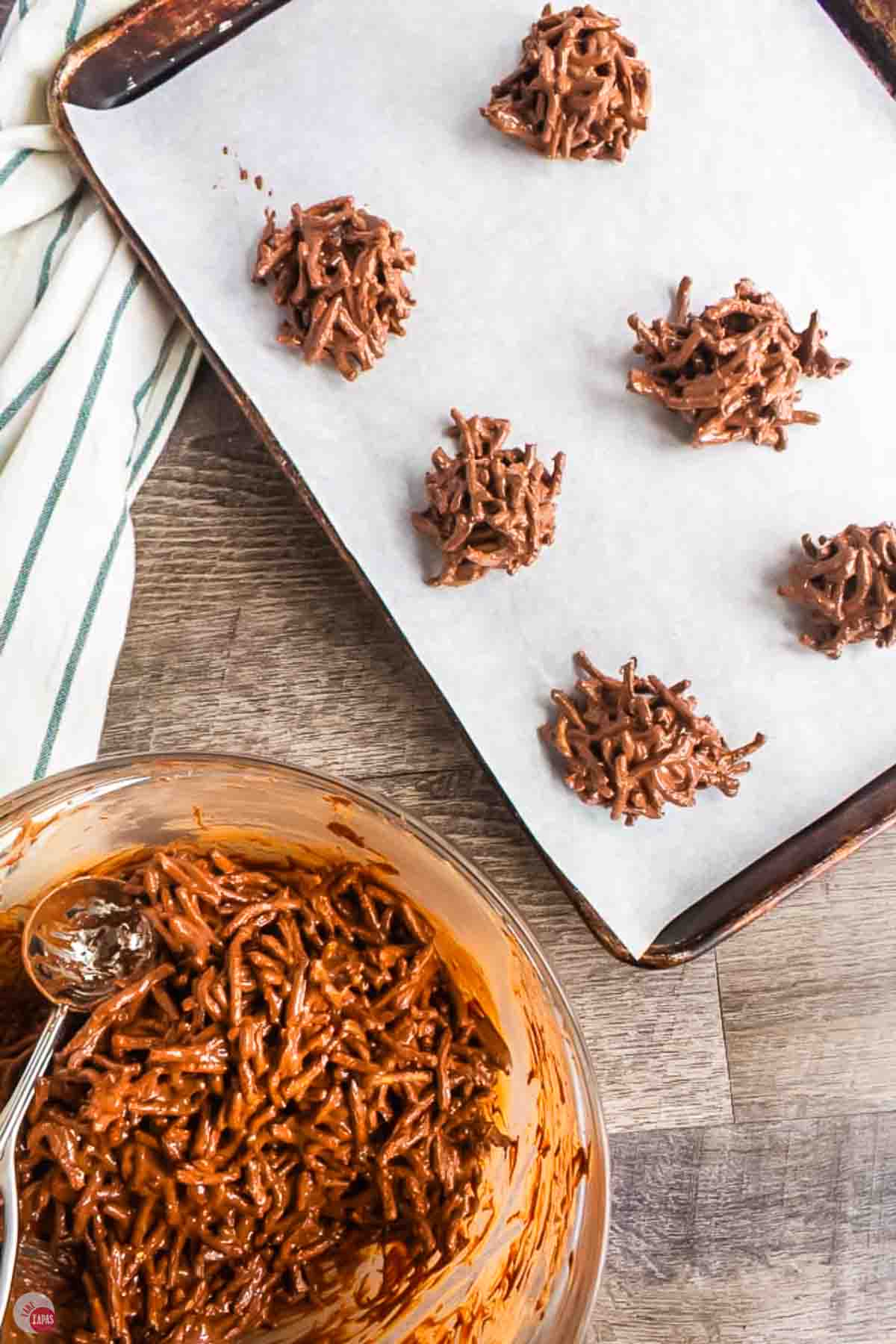 parchment paper with mounds of no bake cookies