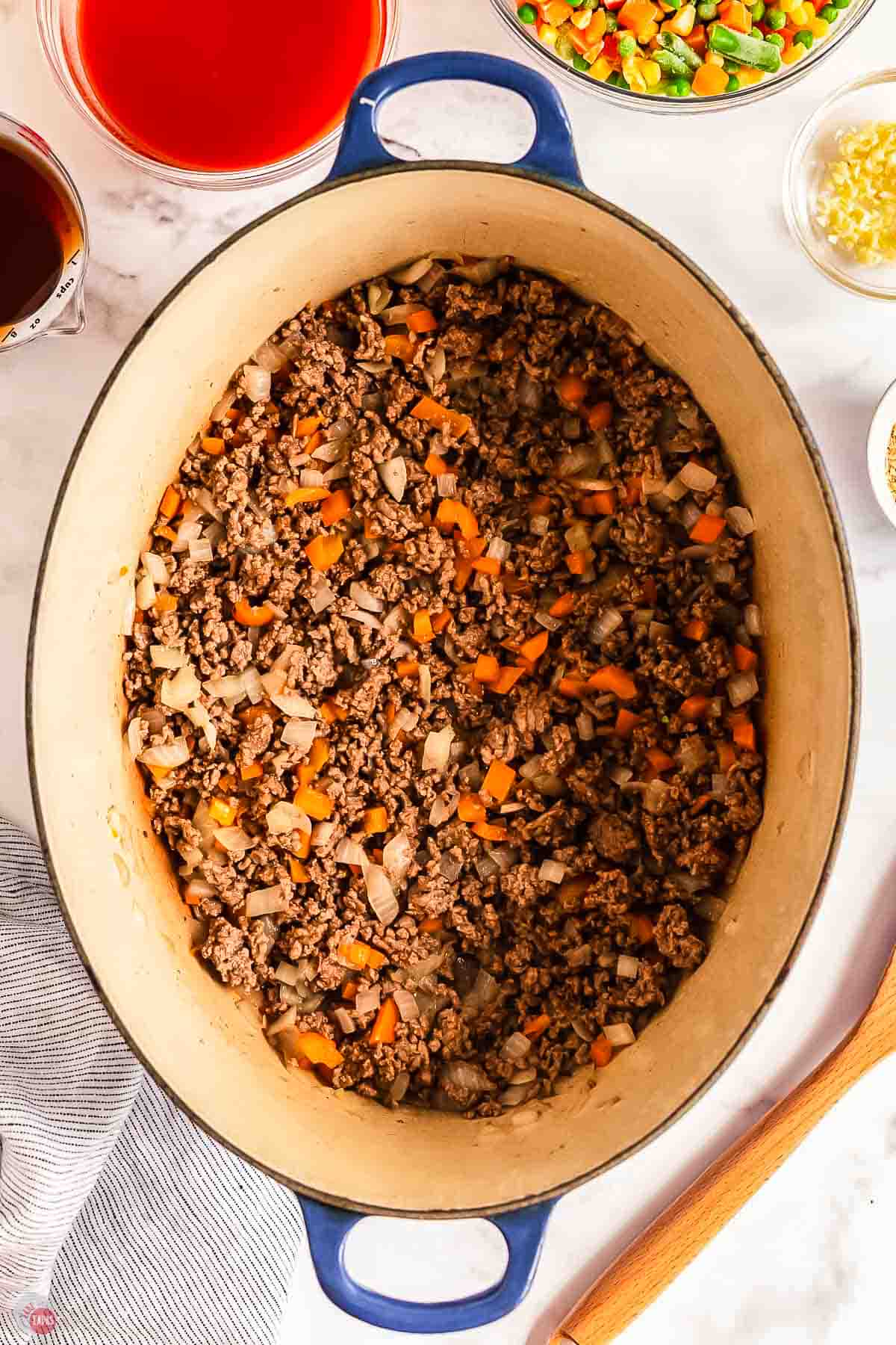 cooked ground beef and onions in a pot