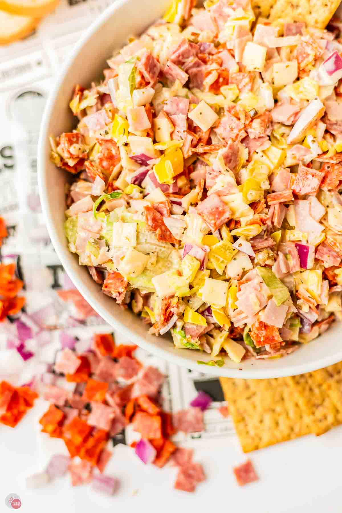 close up of hoagie dip in a white bowl