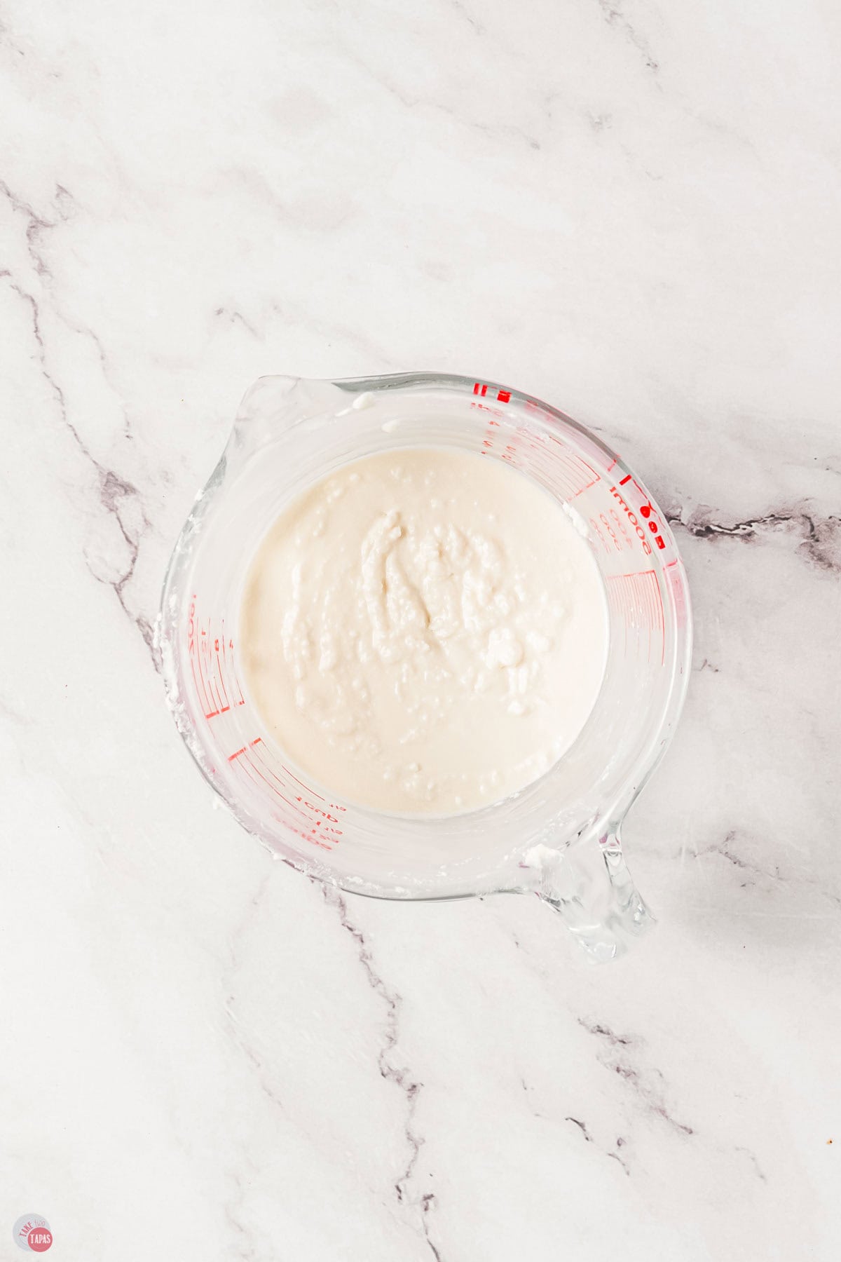 clear bowl with royal icing in it