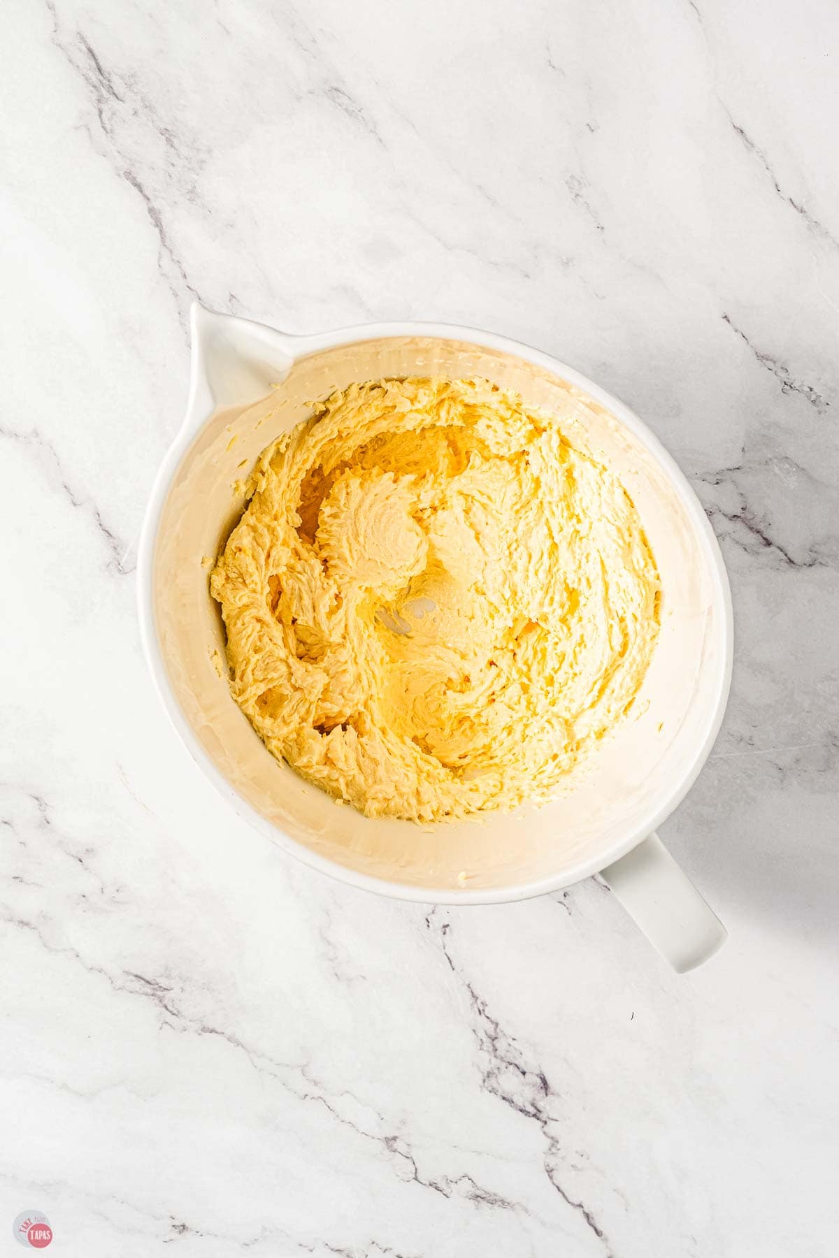 white bowl with whipped butter and sugar