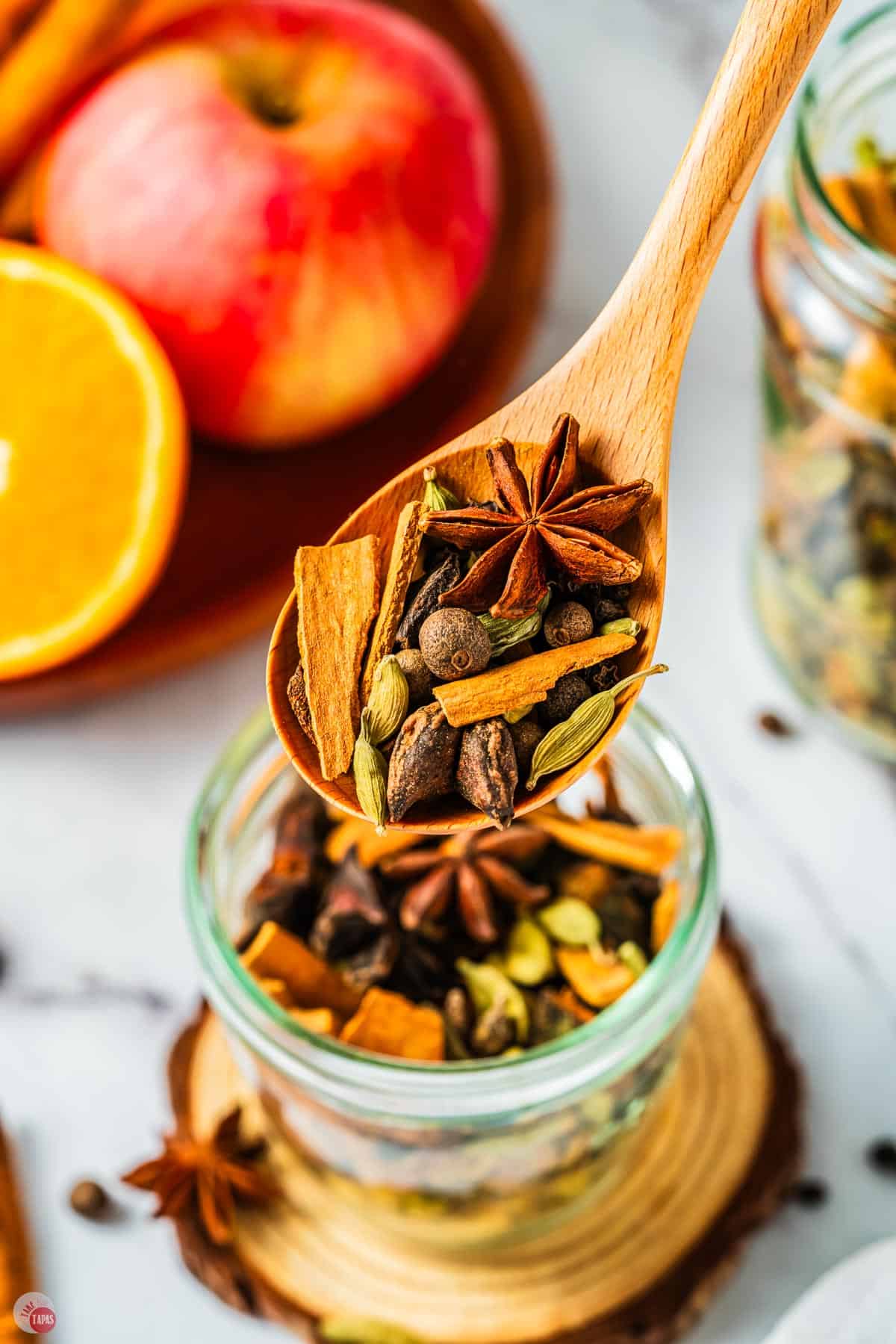 small spoon of spice pods