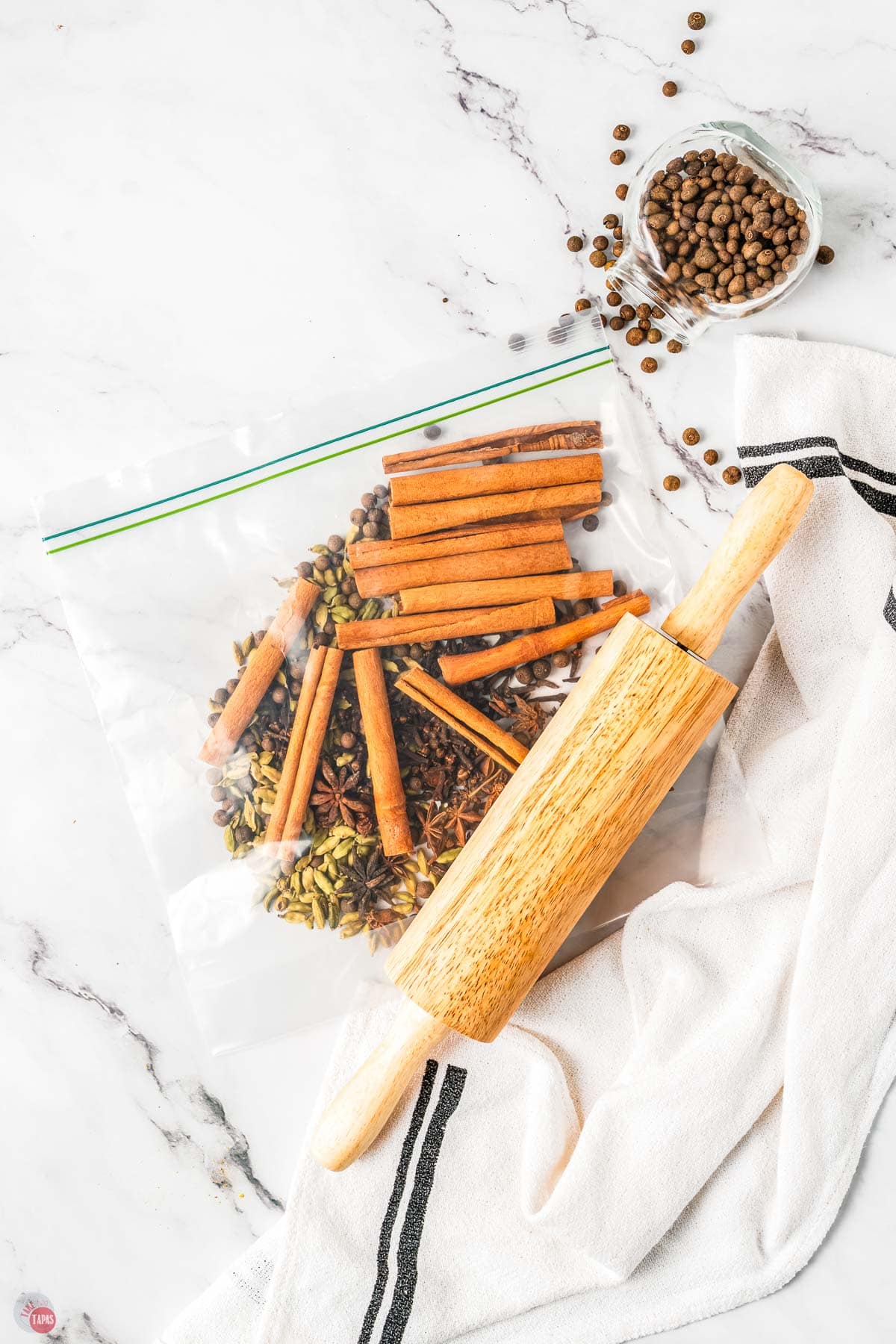 spices in a plastic bag with a rolling pin