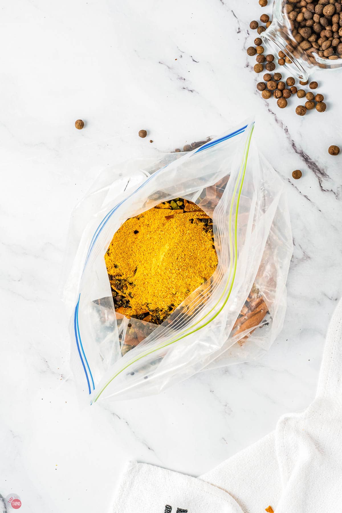 open plastic bag with crushed spices in it