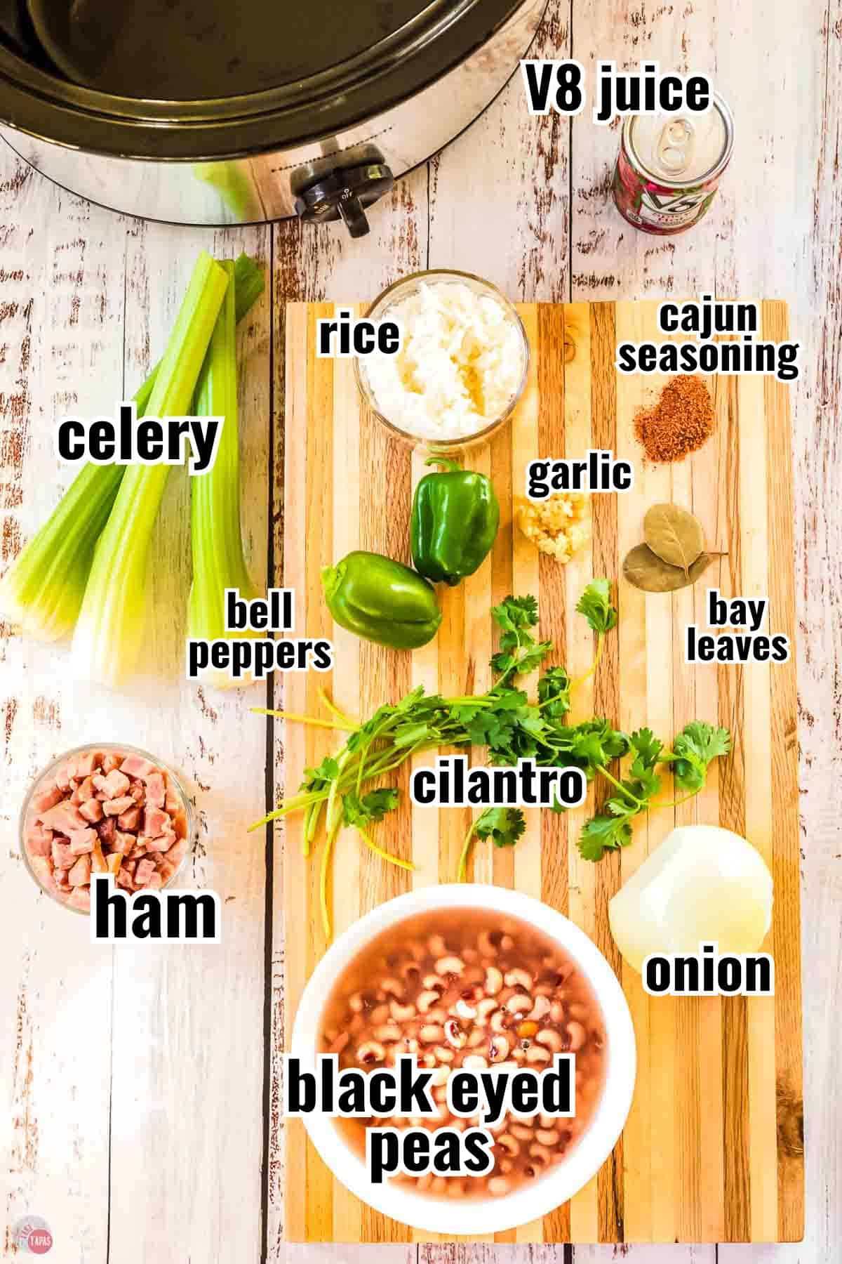 ingredients for a hoppin john recipe in individual bowls with text overlay labeling them