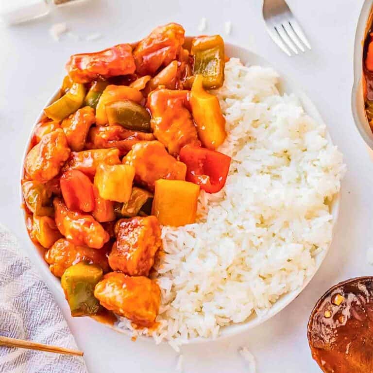 bowl of sweet and sour chicken with white rice