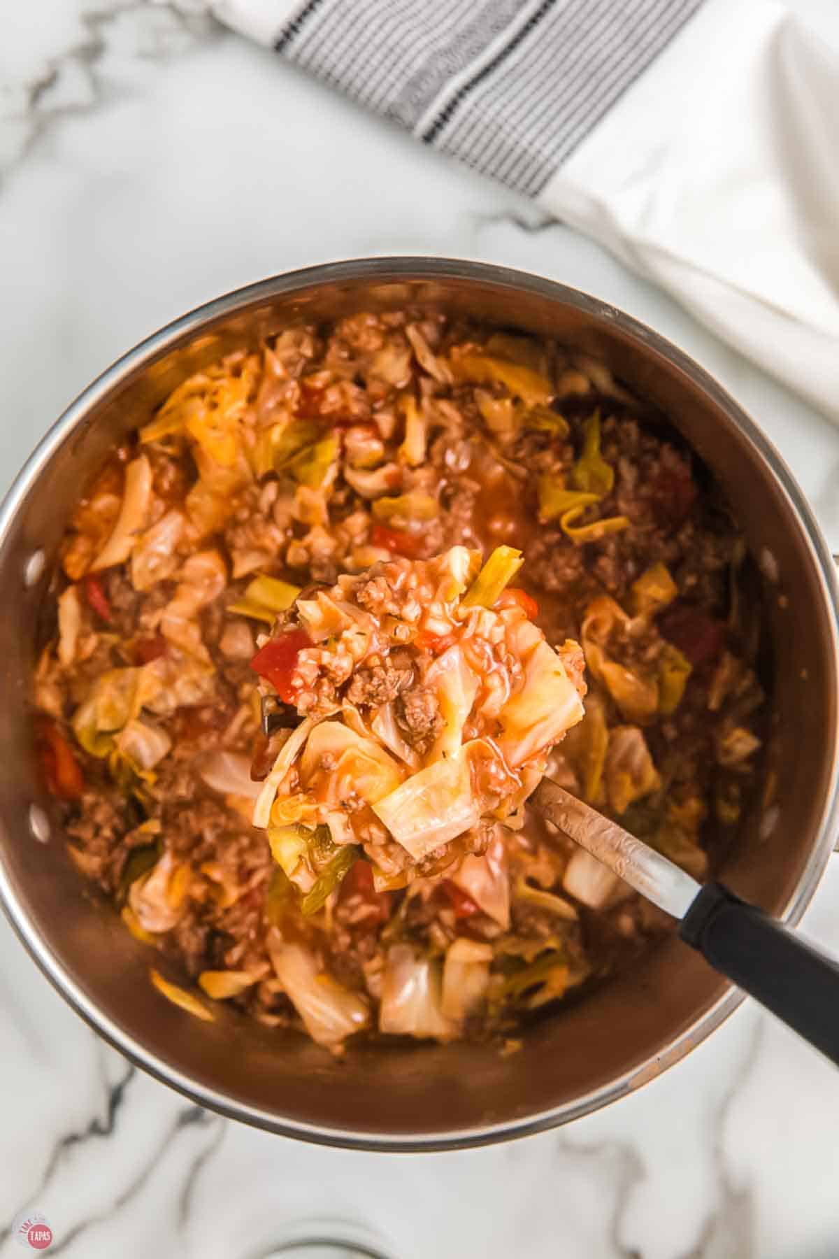 pot of cabbage roll soup with a ladle in it
