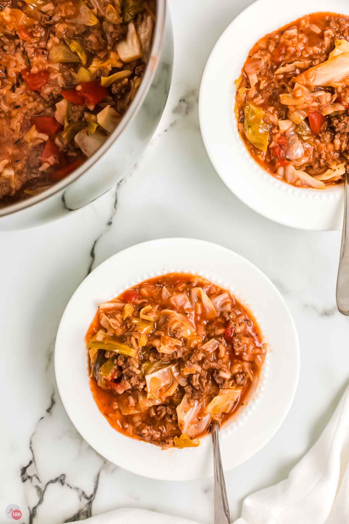 pot and two bowls of soup